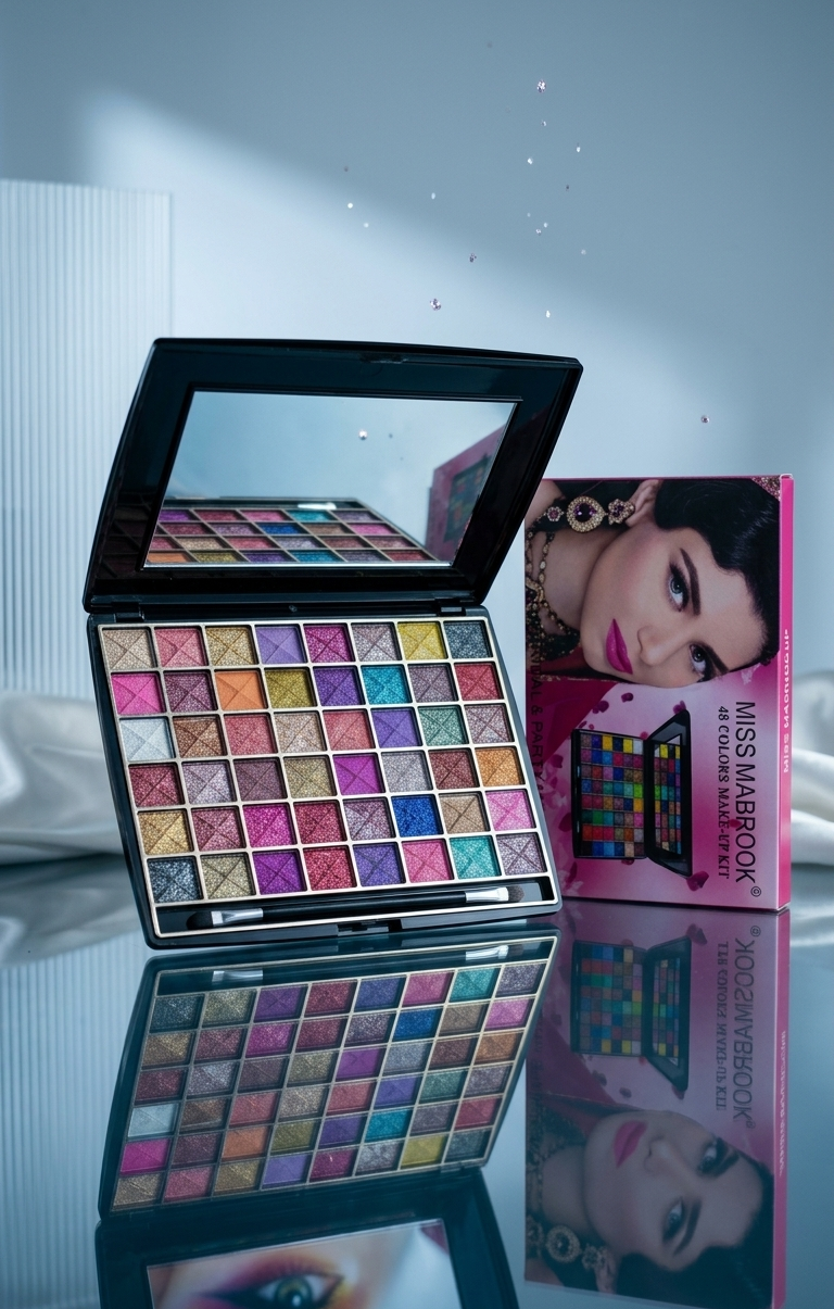Makeup palette with colorful shades and a mirror, displayed on a reflective surface.